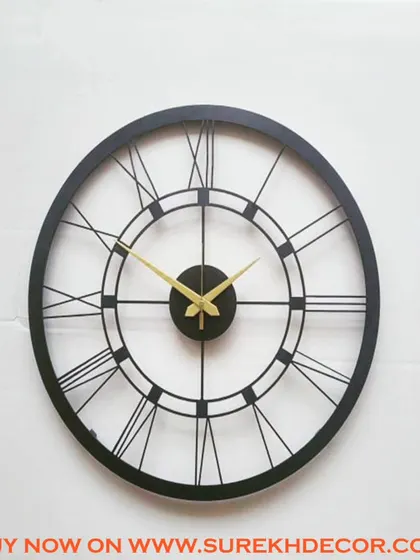 This vintage-style wall clock features a detailed Roman numeral design in a solid black finish. The classic aesthetic is perfect for adding a touch of traditional charm to a modern or transitional space.