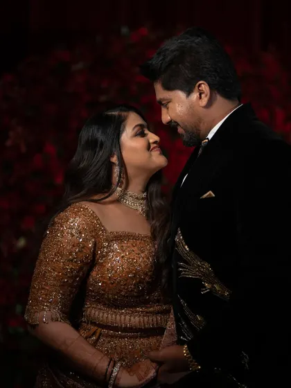 A classic reception portrait. The way they look at each other, with genuine smiles, captures the happiness and love that fills the air on a wedding night.