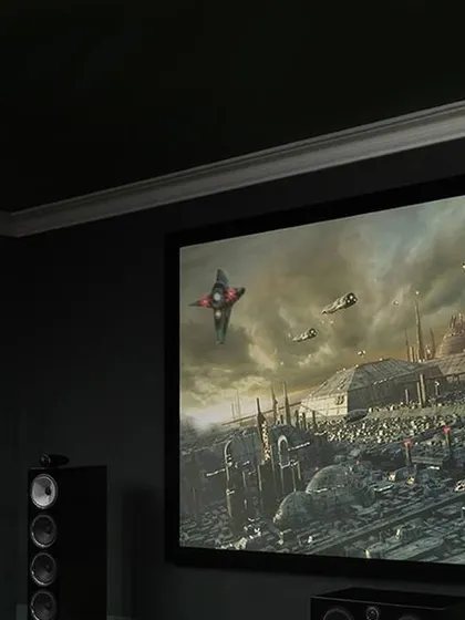 A wider view of a home theater setup featuring Bowers & Wilkins speakers. Their award-winning technology ensures that you hear every detail, from the quietest whisper to the most explosive action sequence.