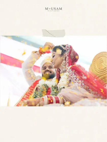 A moment from a Marwadi and Punjabi fusion wedding in Puri. The couple's joy is palpable as they participate in a ritual, showered with petals, their two cultures blending beautifully by the sea.
