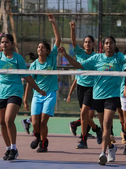 Arms up and ready. Our girls team is full of energy as they go through their warm-up routine, getting mentally and physically prepared for the Shanghai tour.