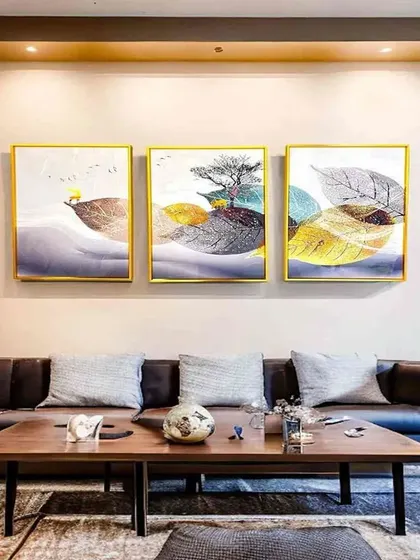 A triptych of crystal paintings that explores the beauty of leaves in abstract form. This set of three 16x24 inch frames creates a sophisticated and naturalistic gallery wall, perfect for a modern living room.