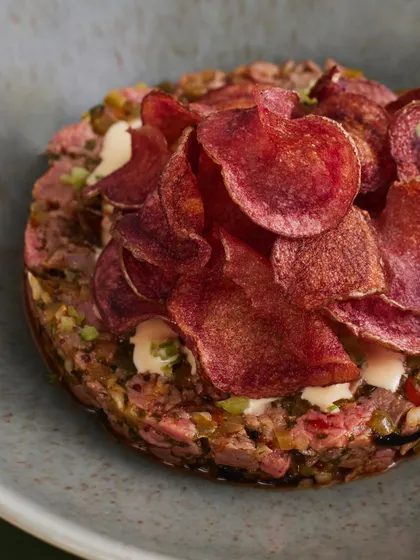 A Plats classic: Seared Steak Tartare. We serve it with a pommery mustard relish, pickled chilies for a bit of heat, and beautiful, crispy mulberry potato chips.