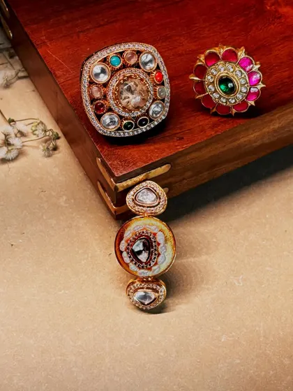 Minimal by size, monumental by presence. A flat lay of three of our statement rings, each with a unique design and combination of stones.