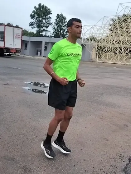 A runner demonstrating excellent form during a drill. Notice the upright posture and focused expression. This is what we strive for.