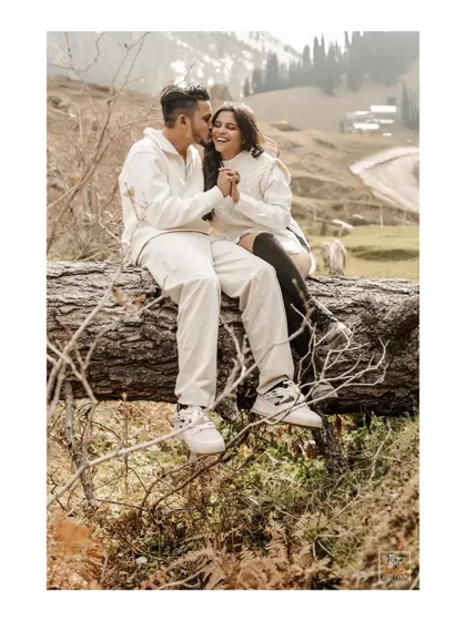 A playful and intimate moment during a Kashmir pre-wedding shoot, showcasing the couple's natural connection.