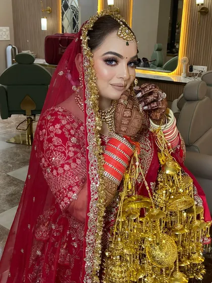 A classic red bridal lehenga deserves a timeless makeup look. For this bride, I focused on a flawless base, defined eyes, and a confident pose, ensuring she felt as incredible as she looked on her big day.