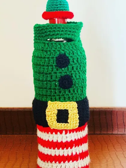 A close-up of the striped elf bottle cover, perfect for adding a touch of whimsy.