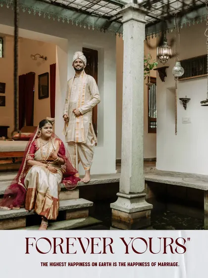 A classic wedding portrait of the couple in a traditional South Indian home.