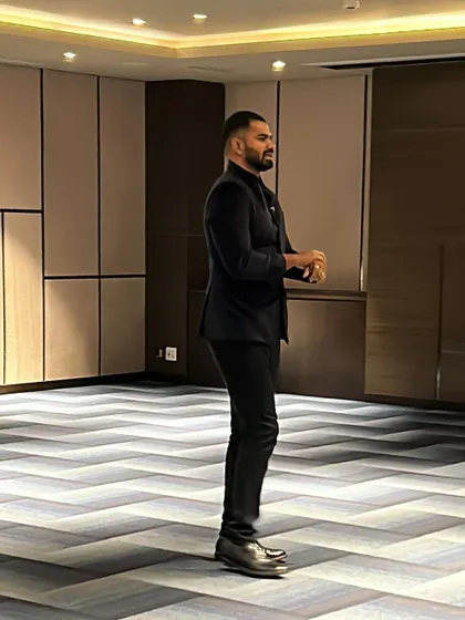 A side profile shot as I move through an event space. My performance isn't confined to the stage; I bring the magic directly to your guests.
