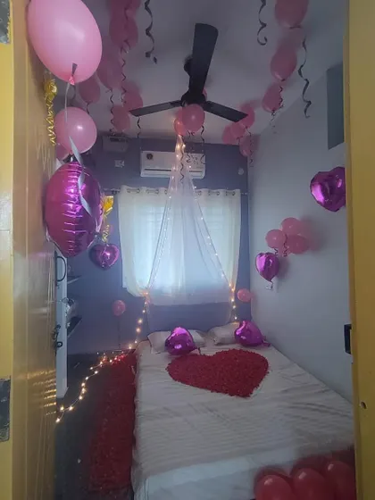 Another view of the romantic room decor, showing how I use balloons and lighting to transform a simple bedroom for a special occasion.
