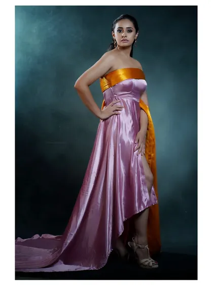 A variation of the pose, showing the full length and train of the gown.