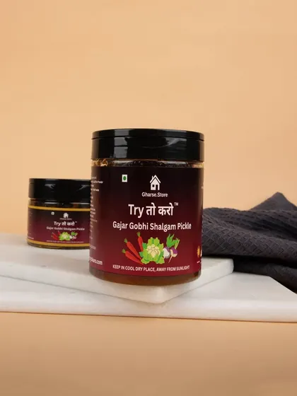 Jars of Gajar Gobhi Shalgam Pickle on a marble slab, creating a clean and modern look for a traditional product.