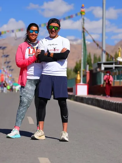 A moment of camaraderie on the race route. A team member and I pause for a photo during the Ladakh Marathon, showing that we are in this together.