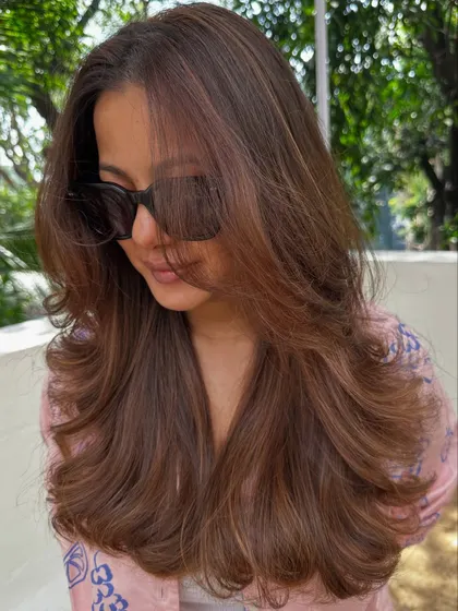 A confident client with her new hair, ready to take on the world.