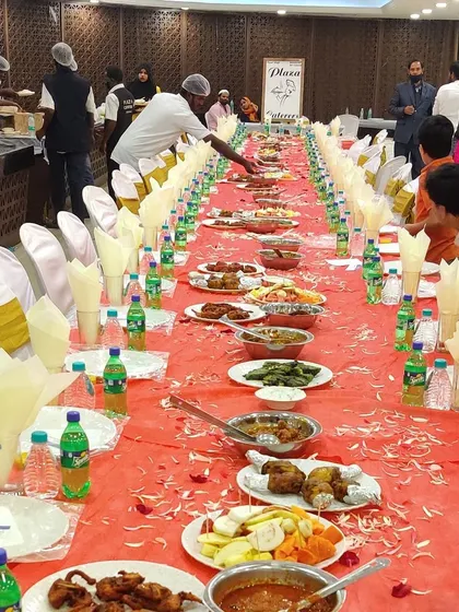 A wide view of our staff serving guests at a packed wedding hall. We are experienced in managing large crowds efficiently, ensuring everyone is served promptly.
