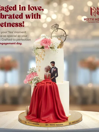 Engaged in love, celebrated with sweetness. This two-tiered engagement cake features a beautiful illustration of the couple and a dramatic red sugar fabric skirt.