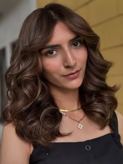 A closer look at a soft brown balayage with face-framing pieces. This technique gives a sun-kissed effect that grows out beautifully and requires minimal maintenance.