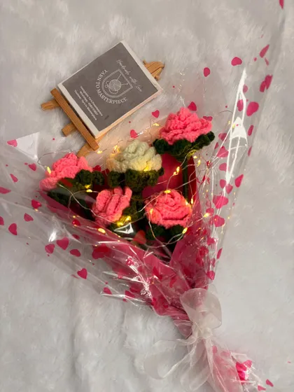 My LED light rose bouquet shown with my brand card. The lights add a magical touch, making it a perfect gift for anniversaries, birthdays, or romantic occasions.