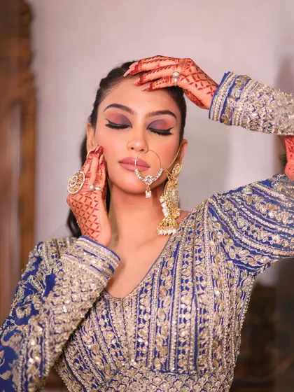 Another close-up of the royal blue lehenga, capturing a dramatic and beautiful pose.