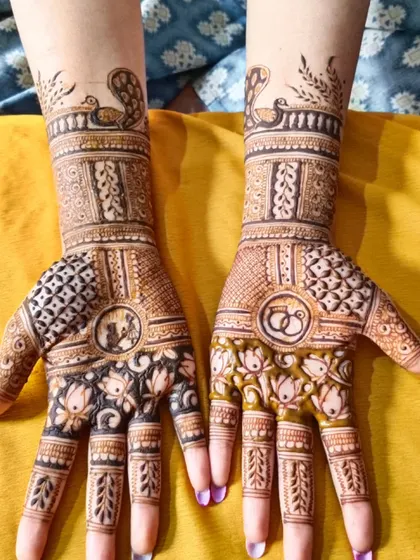 This engagement design features a couple's portrait, intertwined rings, and lotus patterns. The use of both fresh henna and a developed stain in one design shows the transformation.