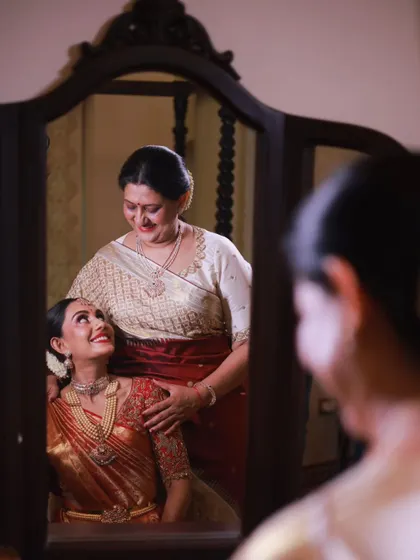 A precious moment between a bride and her mother, captured in the mirror. Creating a calm and happy environment for these memories to happen is a key part of my service.