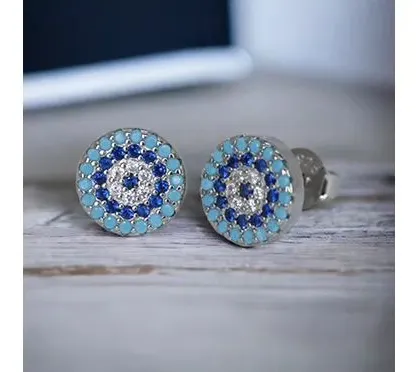 These multi-colored evil eye studs feature concentric circles of blue, turquoise, and white stones for a vibrant and protective design.