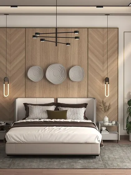 This bedroom design balances natural wood tones with a clean, white aesthetic. The chevron wood paneling behind the bed serves as a warm, textural feature, while the rest of the space is kept bright and airy. Potted plants add a touch of greenery and life.