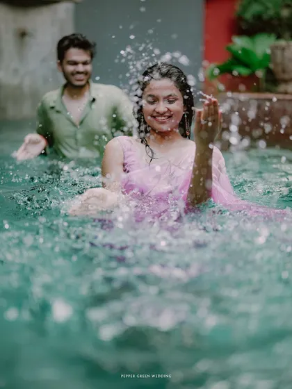 Simran and Pranjal's playful splash in the pool. These fun, energetic shots are a great way to show a couple's joyful side.