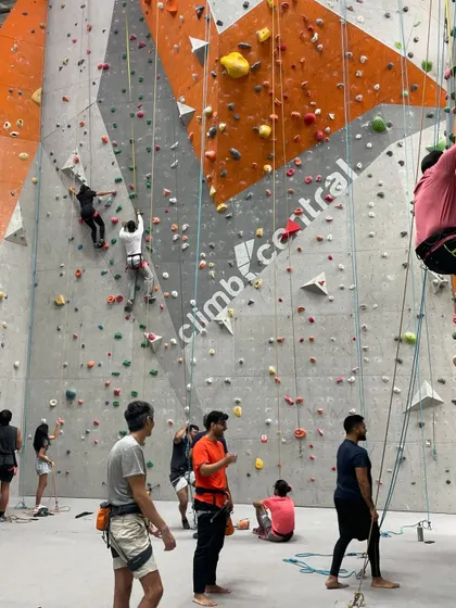 The gym is buzzing with energy. Climbers are on the walls, others are belaying, and some are planning their next route. This is the supportive and active community you'll find here every day.