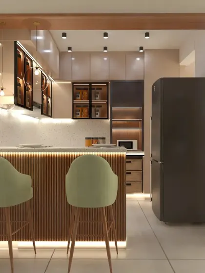 A modular kitchen with a breakfast counter featuring a fluted wood-finish panel. The design uses warm under-cabinet and counter lighting to create an inviting ambiance.