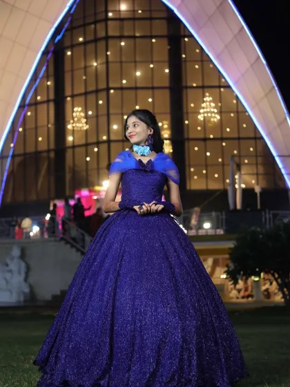 Our client looking like she's straight out of a fairytale in her custom blue gown.