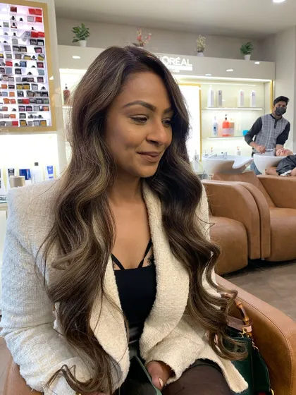 Another angle of this trending ash brown style. The color is rich and dimensional, and it looks stunning in the salon light.