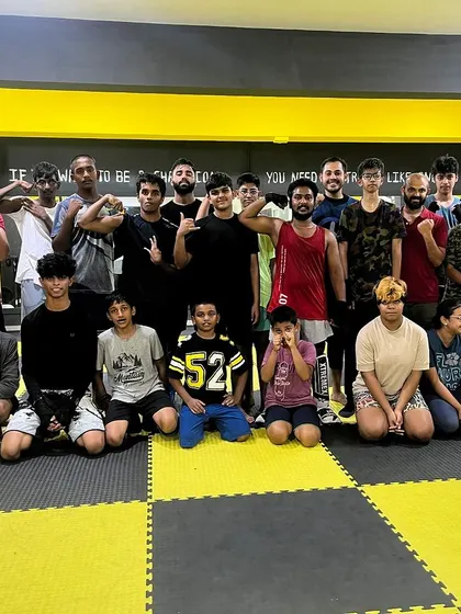 Together, we rise. A group shot that captures the collective spirit of the 1026 MMA family.