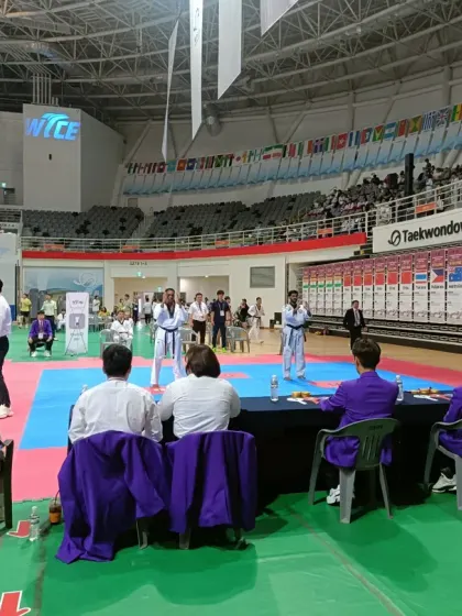 My student performing her Poomsae routine in front of the judges and a large audience.