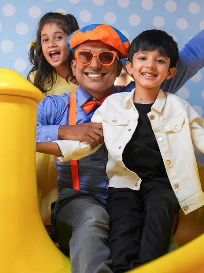 Blippi joining the kids on the slide. Our entertainers are always ready to jump into the fun and play alongside the children.