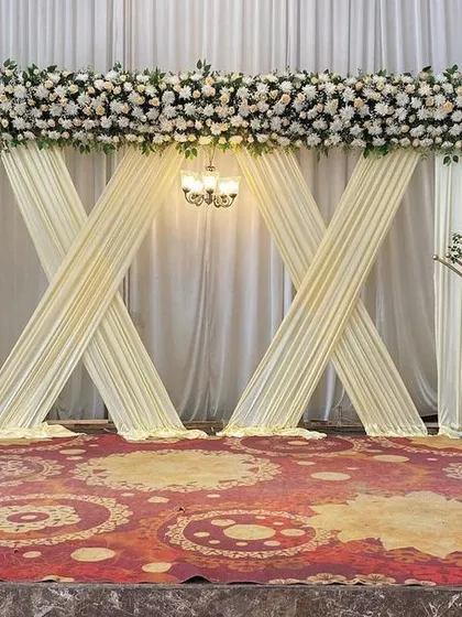 A full view of our elegant reception stage design, which is versatile enough for various post-wedding functions and complements any convention hall.