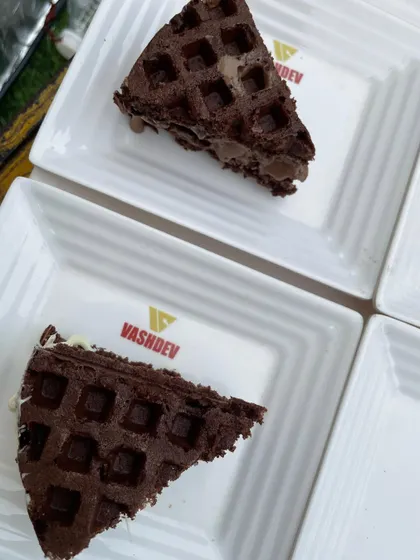 Our rich chocolate waffles are a delight for any dessert lover. Served on our custom Vashdev plates, they provide a sweet and satisfying end to any meal.
