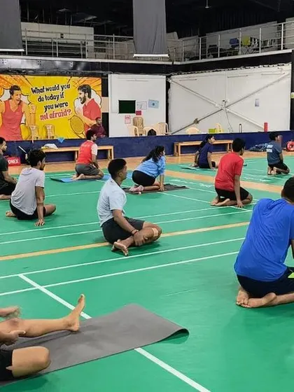 A wide view of a stretching and mindful movement session in progress at our Sarjapura academy. We utilize our court space for these activities to build a holistic training environment where every aspect of athlete well-being is addressed.