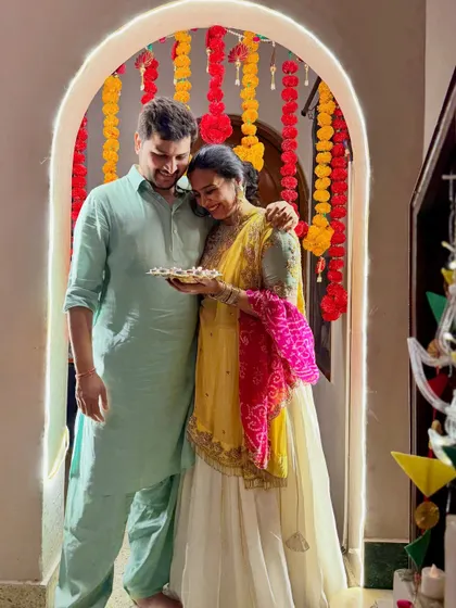 A candid, romantic moment with my husband during our Diwali celebration. This photo adds another dimension to my festive content, showing the couple's bond amidst the family festivities.