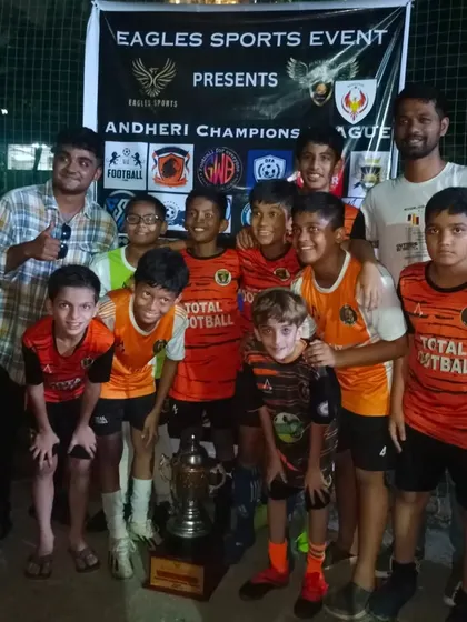 Our U13 champions celebrating with coaches and parents after winning the Andheri Champions League.