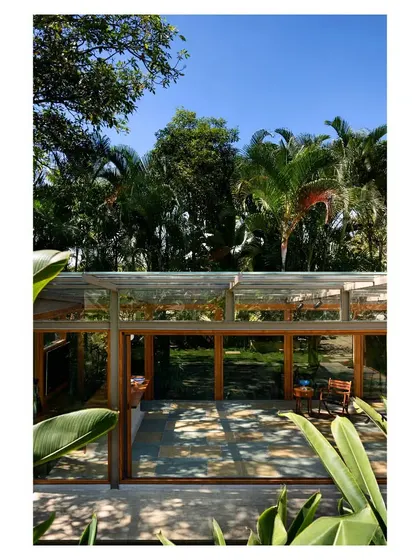 An elevated view looking down into the Komorebi Pavilion, revealing the pattern of dappled light on the Kota stone floor. The interior is a canvas for the changing light, reflecting our belief that architecture should be animated by nature.