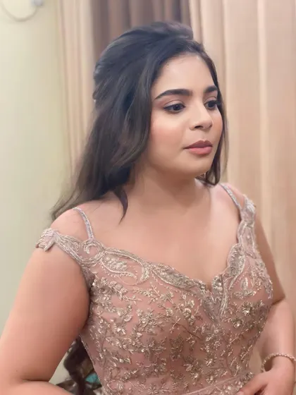 A close-up of the soft glam makeup for this party look. The skin is smooth and radiant, and the eye makeup is blended to perfection.