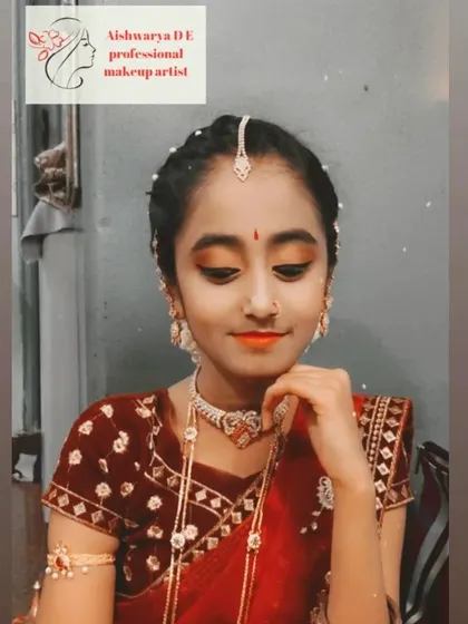 A soft and age-appropriate makeup look for a younger client. I used warm, shimmery tones on the eyes and a subtle orange lip to match her traditional half-saree.
