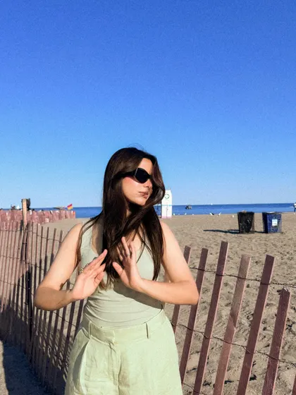 A candid, windswept moment from a perfect beach day.