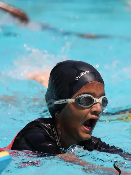 Action shots of our students practicing their strokes. Whether it's using a kickboard or working on breathing, every lap is a step forward.