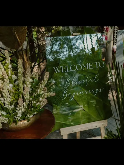 A close-up of the 'Welcome to Blissful Beginnings' sign.