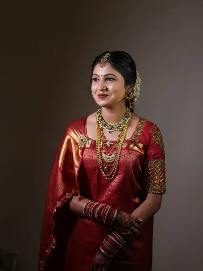 This shot captures the bride's gentle smile and the beautiful glow of her skin, a hallmark of my makeup style.