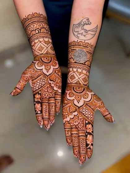 A different angle showing how the mehendi complements the tattoos on the bride's arms. I can adapt my designs to work with any existing body art.