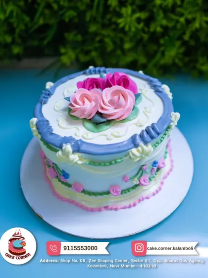 A classic floral cake with beautiful pink and purple piped roses. The simple and elegant design is perfect for any occasion that calls for a touch of beauty.